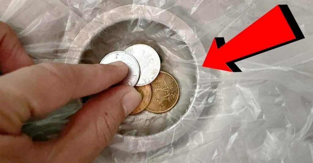 coins in hotel bathroom sink